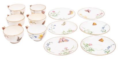 A set of six Minton porcelain 'butterfly' cups and saucers with butterfly handles and painted with