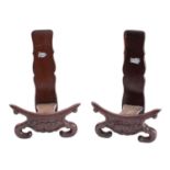 A pair of Chinese carved hardwood plate stands;