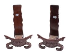 A pair of Chinese carved hardwood plate stands;