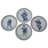 A set of four Chinese blue and white 'Immortals' saucer dishes each depiction painted within a key