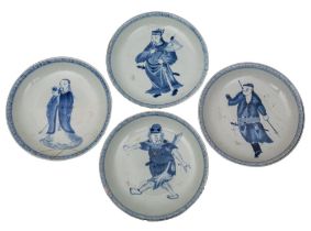 A set of four Chinese blue and white 'Immortals' saucer dishes each depiction painted within a key