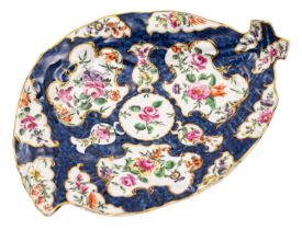A First Period Worcester blue scale leaf-shaped dish painted with floral sprays within gilt edged