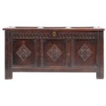 A late 17th-century oak rectangular coffer; with a plain triple panelled hinged top,