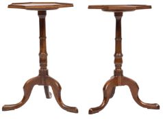 A matched pair of mahogany octagonal occasional tables, in the George III style; moulded tops,