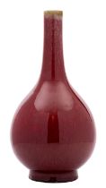 A Chinese sang-de-boeuf bottle vase with globular body, the glaze falling short of the slender neck,