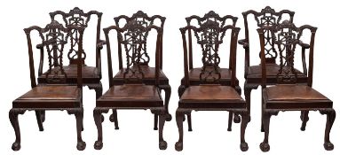 A set of eight carved stained beechwood dining chairs in the Chippendale style,