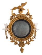 A Regency carved giltwood and gesso circular convex girandole wall mirror;