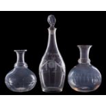 A glass decanter and two carafes, the former of club shaped form with lozenge stopper,