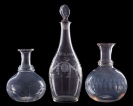 A glass decanter and two carafes, the former of club shaped form with lozenge stopper,