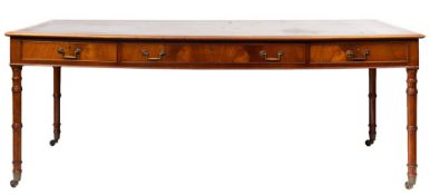 A mahogany and gilt tooled leather inset library table in Regency style,