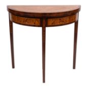 A contemporary marquetry demi-lune card table; decorated with floral foliage and ribbons,