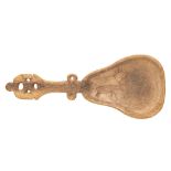 An Inuit carved reindeer horn spoon; the pear-shaped bowl with incised decoration of a reindeer,