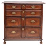 A George I oak chest of drawers, circa 1720; the top with moulded front and side edges,