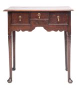 A George II oak lowboy side table,