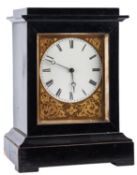 A small ebonised Victorian French mantel clock having an eight-day duration timepiece movement,