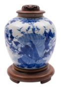 A Chinese blue and white jar painted with two birds above rockwork and flowering peony,