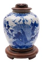 A Chinese blue and white jar painted with two birds above rockwork and flowering peony,