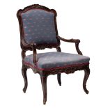 A Louis XV carved and stained wood and later upholstered fauteuil,