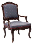 A Louis XV carved and stained wood and later upholstered fauteuil,