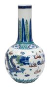 A Chinese doucai dragon bottle vase painted with opposing dragons persuing the sacred pearl amongst