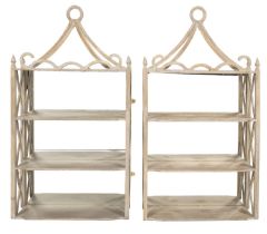 A pair of painted wood mirror back wall shelves,