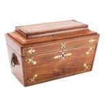 A George IV hardwood, probably padouk and brass inlaid tea caddy, circa 1825; of sarcophagus form,