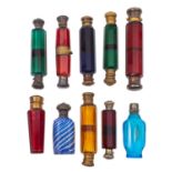 A group of ten late 19th century coloured glass scent bottles some double ended,