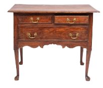 A George II pine lowboy side table, mid 18th century; the top with moulded edges,