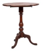 A Victorian mahogany tripod table, mid 19th century; the shaped oval top, baluster stem,