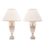 A pair of alabaster vase shaped table lamps;