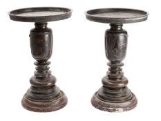 A pair of Japanese bronze vases in three parts, with circular flattened top sections,