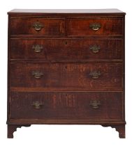 A George III oak rectangular chest; the top with a reeded edge,