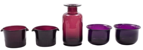 A mixed group of amethyst coloured glass, including a ships decanter, wine glasses,