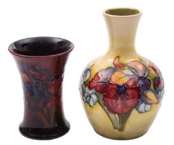 Two William Moorcroft pottery vases, both tube lined in the Orchid pattern,