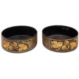 A pair of Regency parcel gilt black papier mâché bottle coasters,