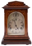 An Edwardian mahogany chiming German mantel clock the eight-day duration movement striking the