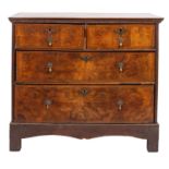 An early 18th Century walnut and oak rectangular chest, on a later oak stand,