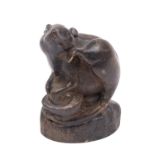 A Chinese bronze figure of a rat, modelled seated on a pile of coins protecting a nut,