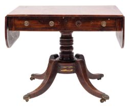 A Regency rosewood and inlaid sofa table; bordered with satinwood lines,