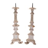 A pair of Continental painted and parcel giltwood pricket sticks,