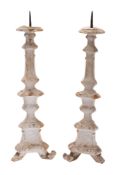 A pair of Continental painted and parcel giltwood pricket sticks,
