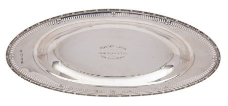 A George V silver presentation tray, Barker Brothers Silver Ltd, Birmingham 1931, of oval form,