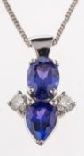 A platinum tanzanite and diamond pendant,