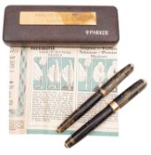Two Parker Vacumatic Fountain Pens, both laminated golden brown with gilt fittings,