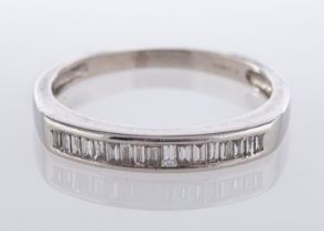 A platinum, diamond quarter-eternity ring, pave set with baguette cut stones, ring size N,