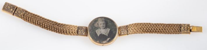 A hairwork memorial bracelet, the clasp with floral engraving,