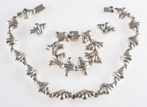 A Mexican silver coloured necklace, composed of polished scalloped panels, stamped 925, TC-89,