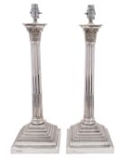 An impressive pair of Elizabeth II silver Corinthian column lamps, Gibson & Co Ltd (Belfast),