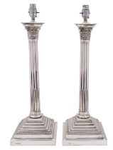 An impressive pair of Elizabeth II silver Corinthian column lamps, Gibson & Co Ltd (Belfast),