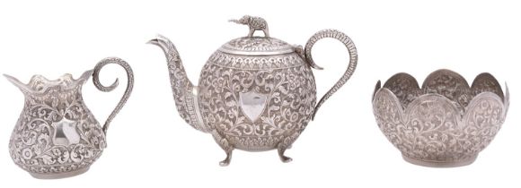 An Indian three-piece silver tea set, unmarked, early 20th century, of globular form,